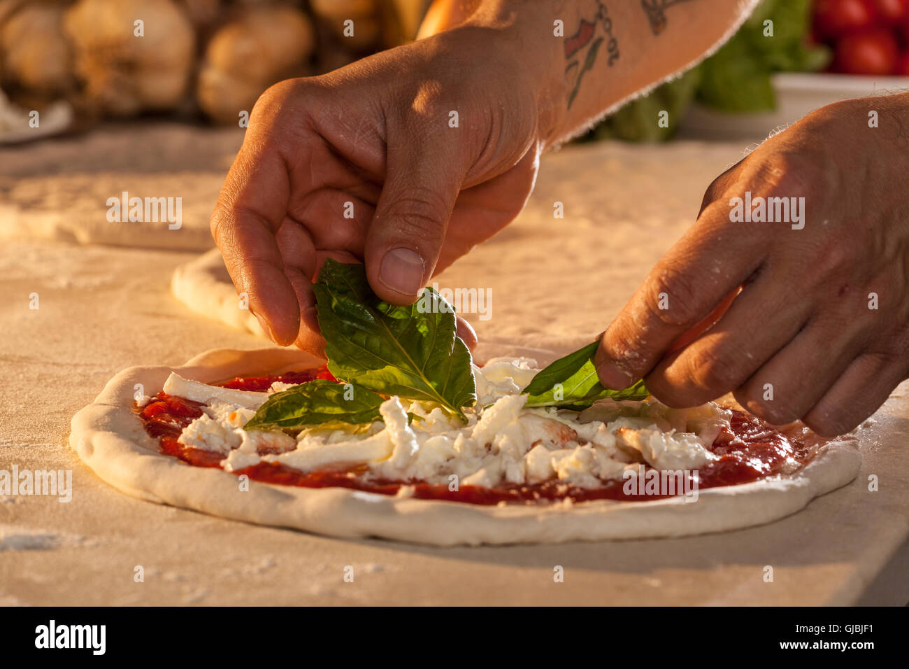 Pizza, the making of... Pizza Margherita Stock Photo