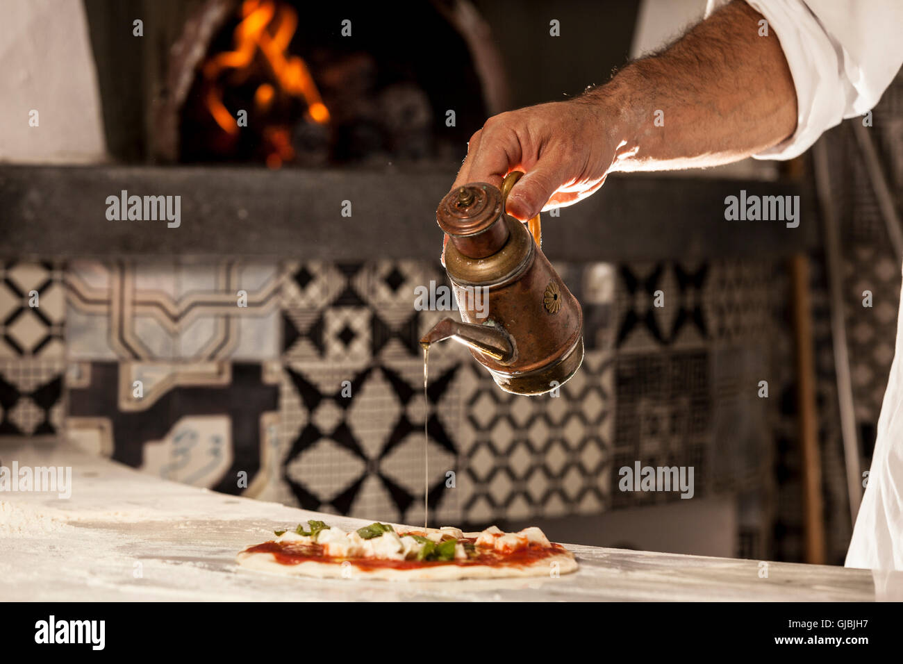 pizza by the oven Stock Photo