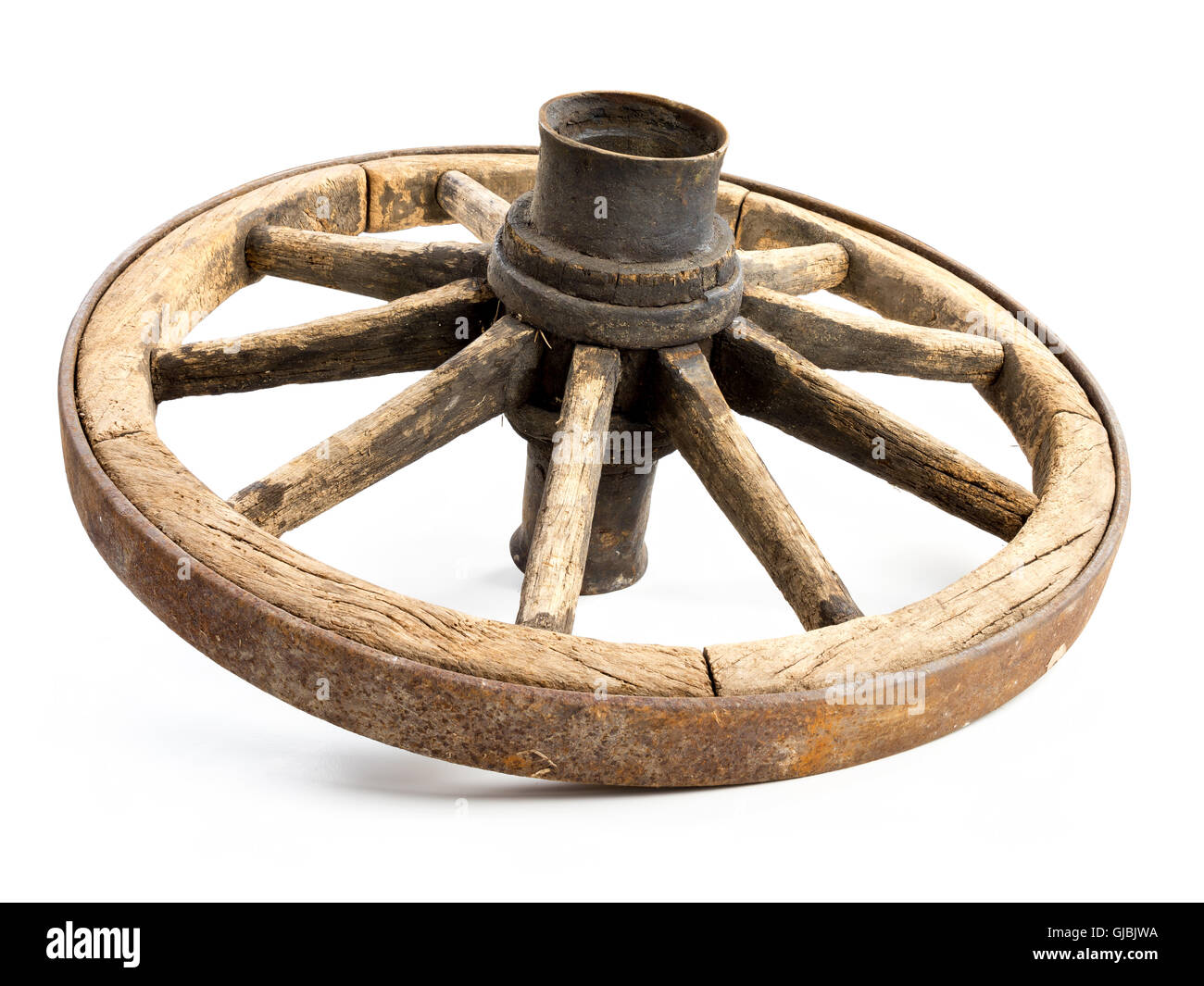 Old wooden wagon wheel isolated on white background Stock Photo