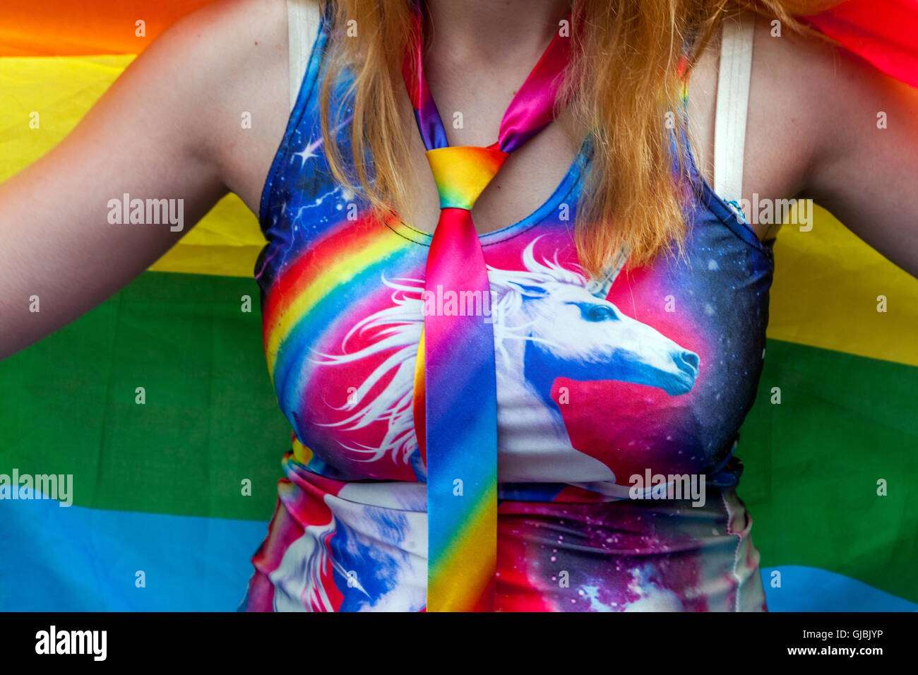 Woman Unicorn picture on her colorful dress, LGBT flag, Prague Pride, Czech Republic woman in summer dress Stock Photo