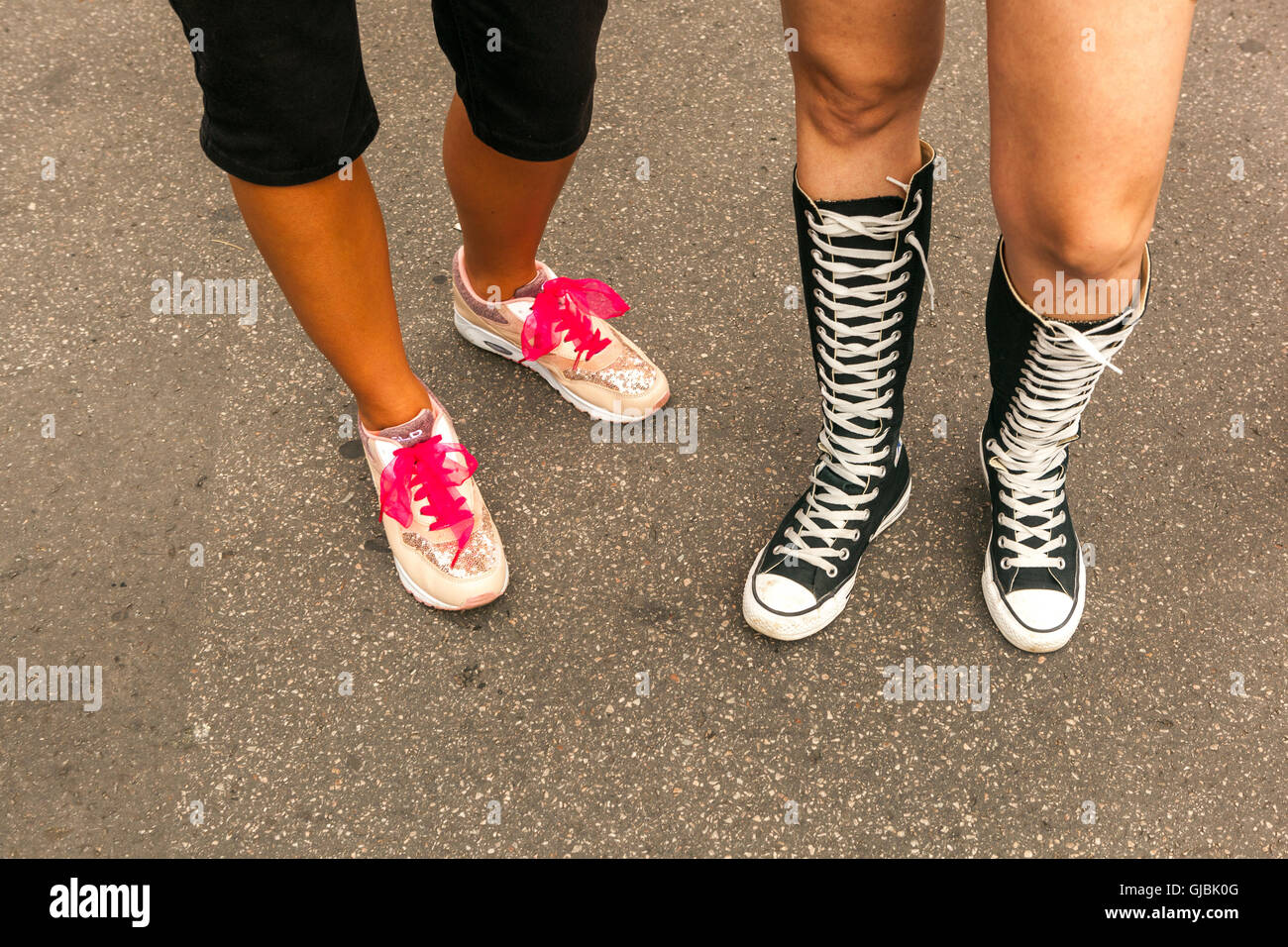 Black lacing sneakers, teenagers fashion trendy women Stock Photo