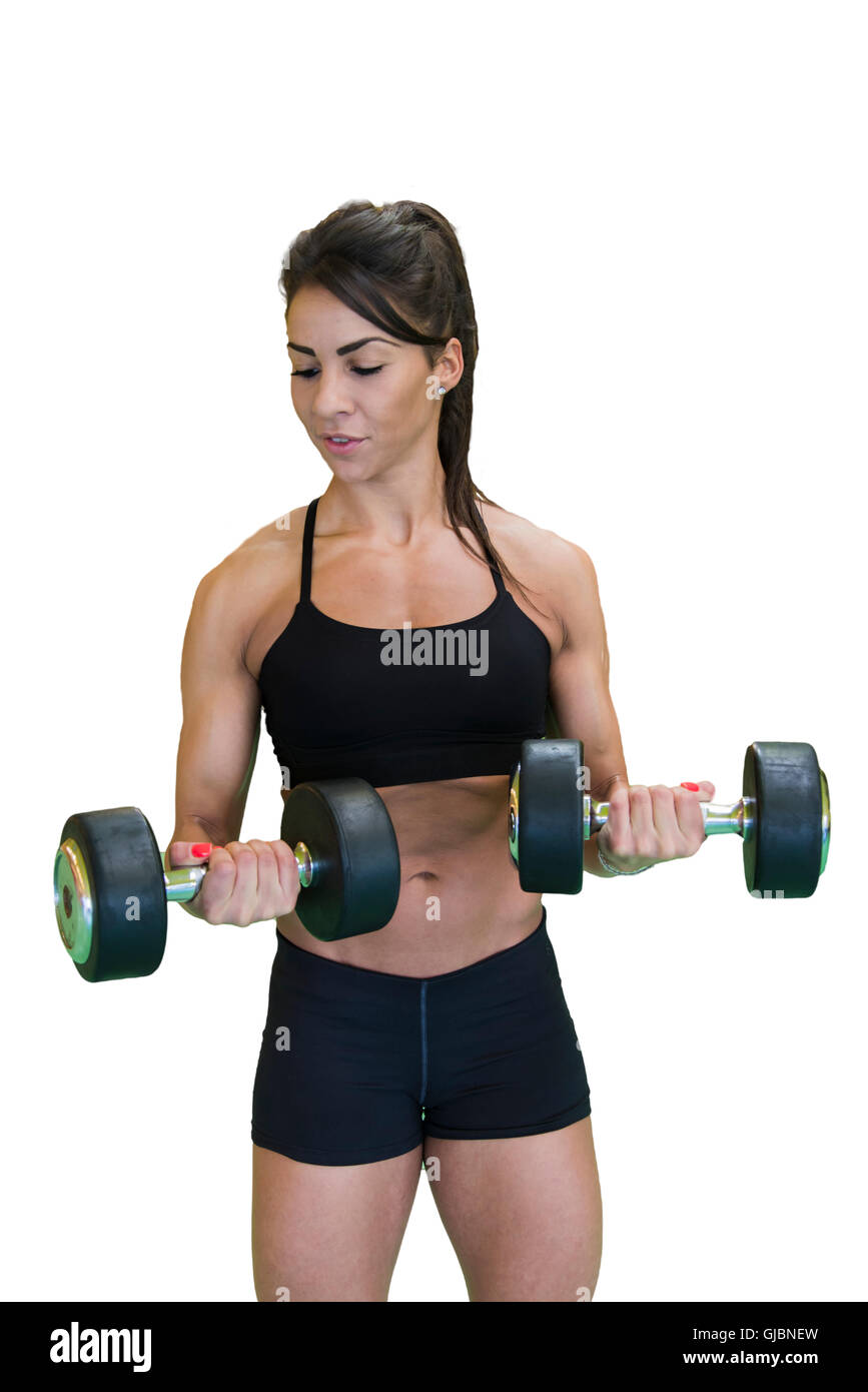 Woman with dumbbells training in the gym Stock Photo