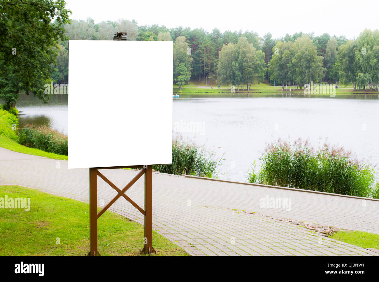 Mock up. Vertical blank billboard in park Stock Photo - Alamy