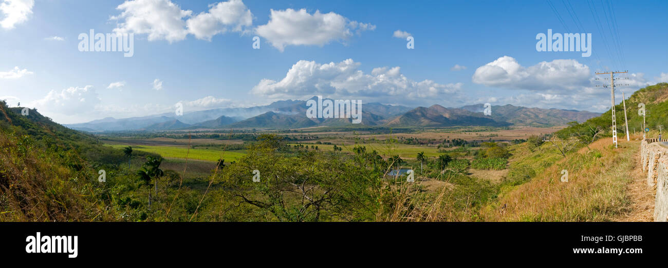 Forest fires burn on the distant hills in this panoramic view of the Cuban countryside. Stock Photo