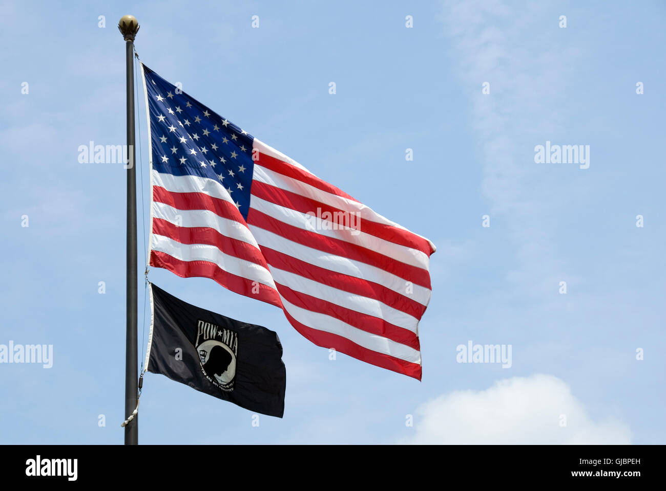 The flags of the United States of America and its POW-MIA organization flying together in Washington, DC. Stock Photo