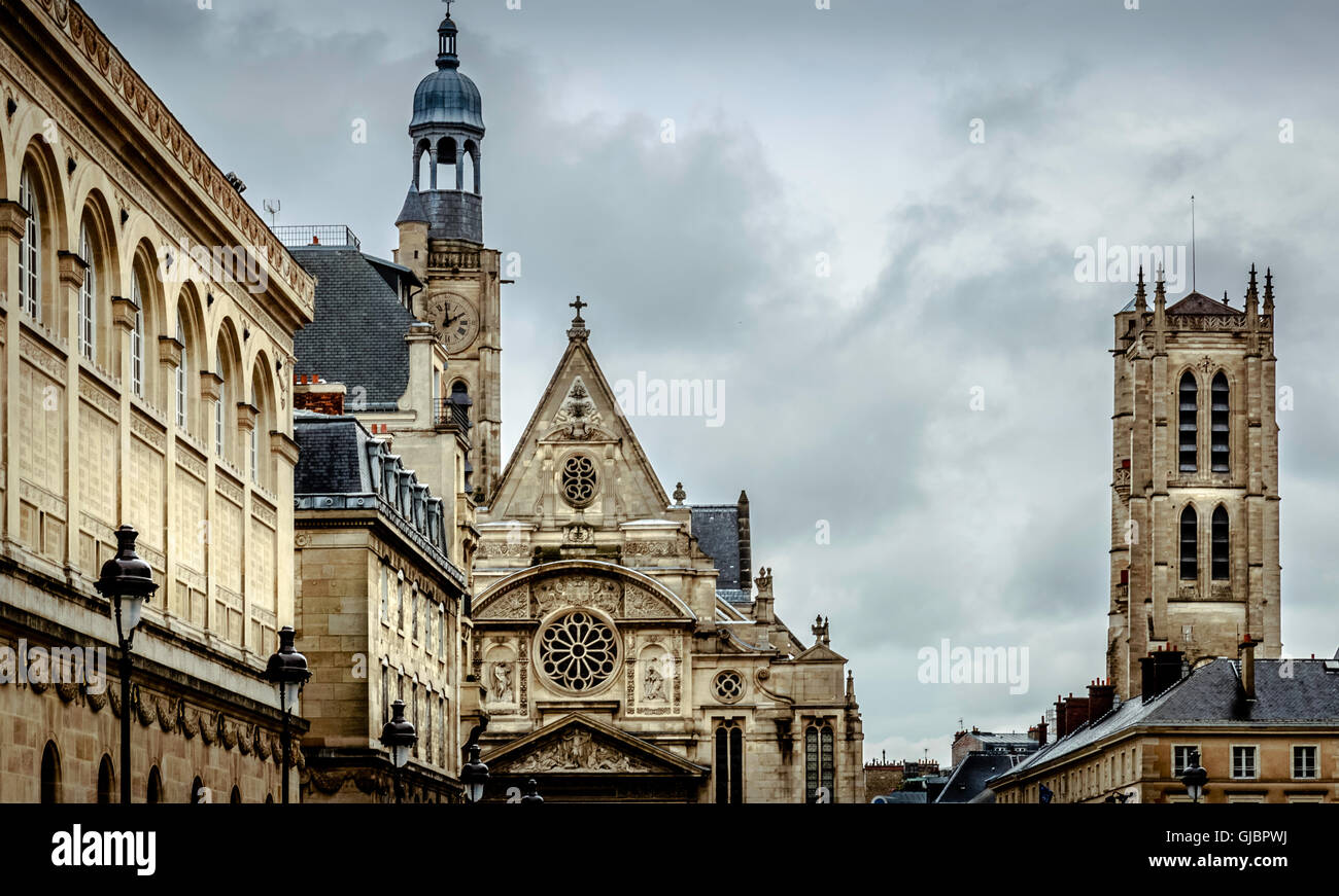 Church steeples against a cloudy sky in Paris Stock Photo