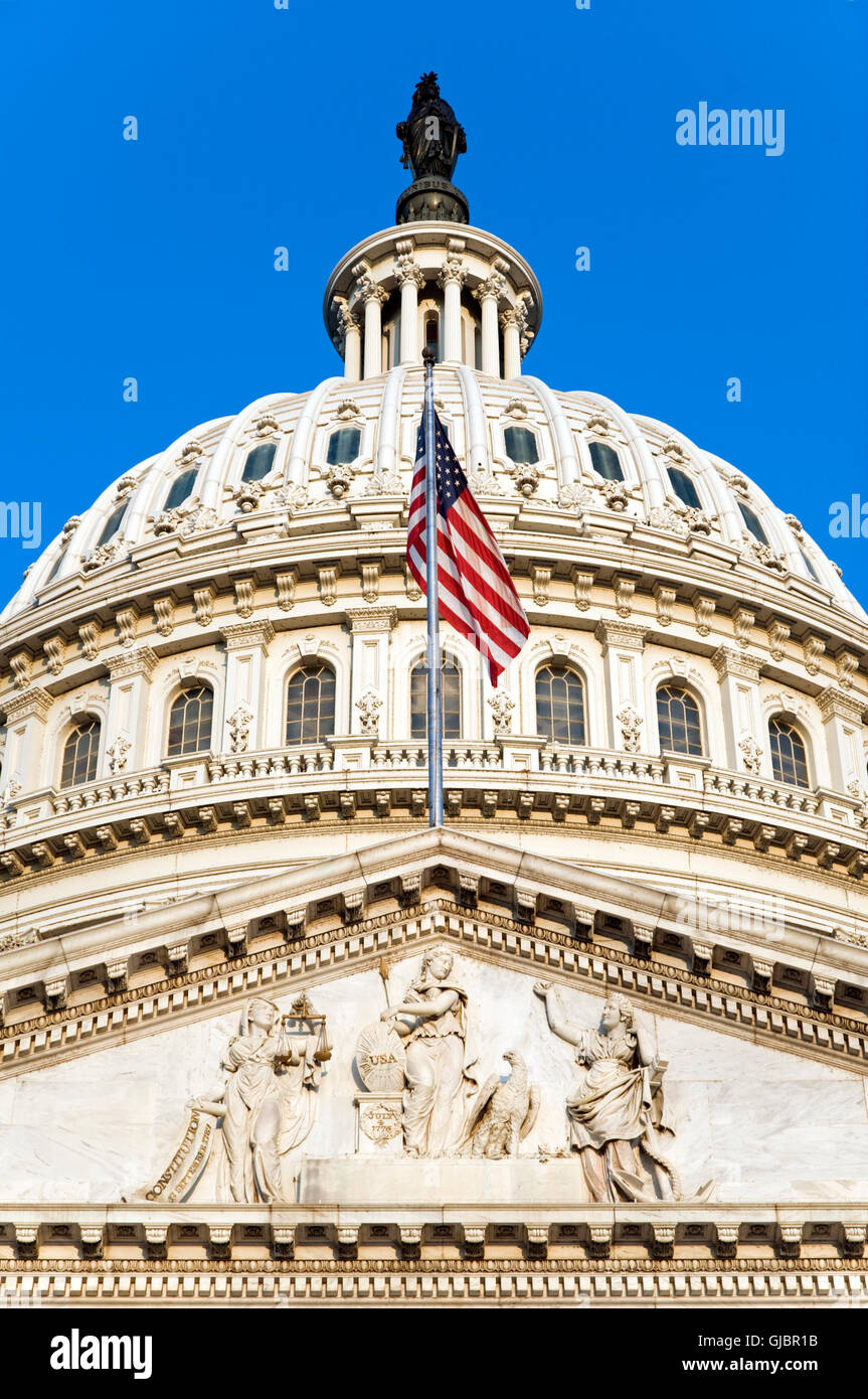 The flag of the USA flying on the east side of the Capitol building in Washington, DC, shortly after dawn. Stock Photo