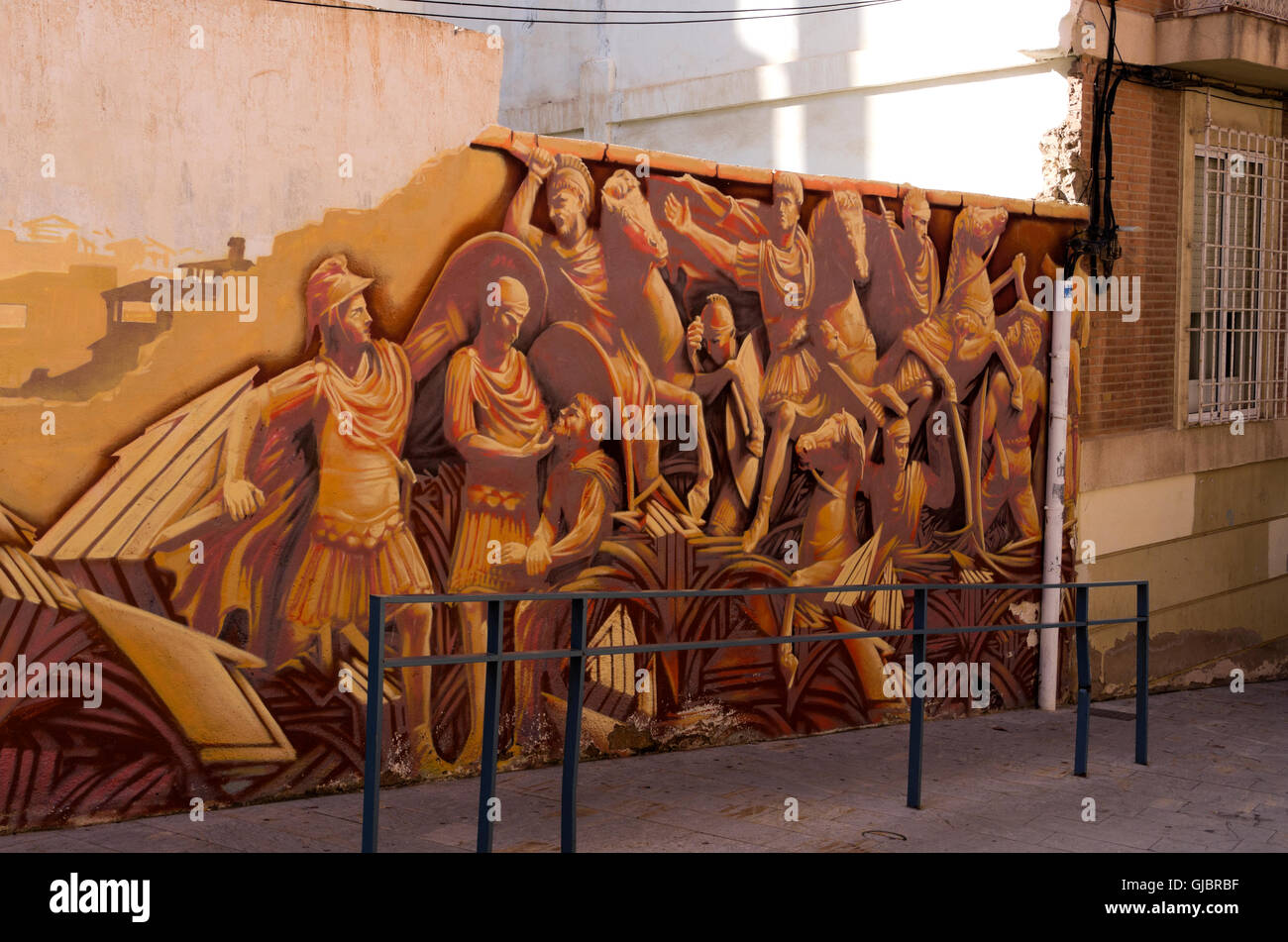 Roman gladiator mural painted on wall of building in reconstruction Stock Photo