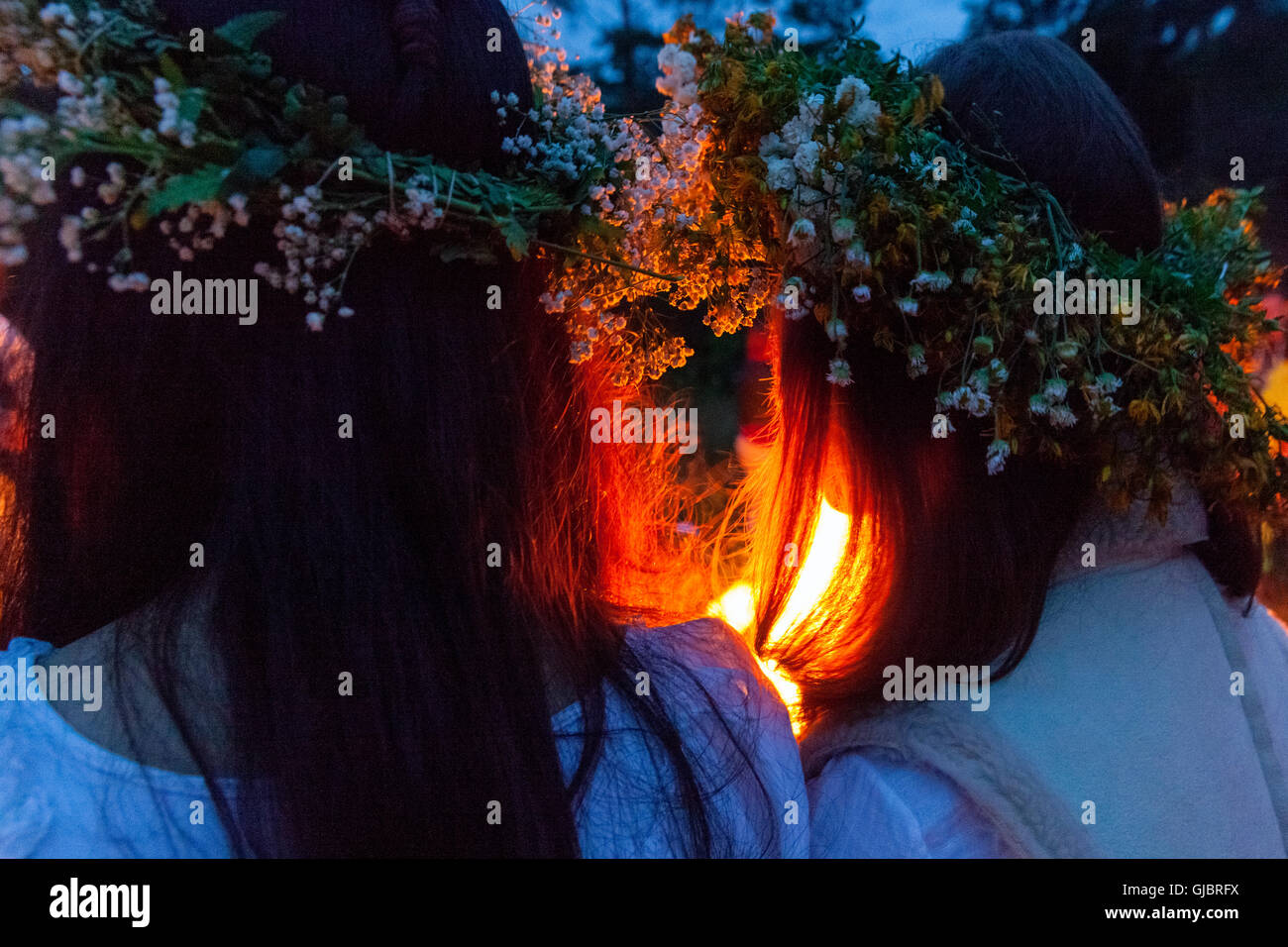 Midsummer Night, girls in wreaths on his head, by the fire, Podlasie, Poland, Stock Photo