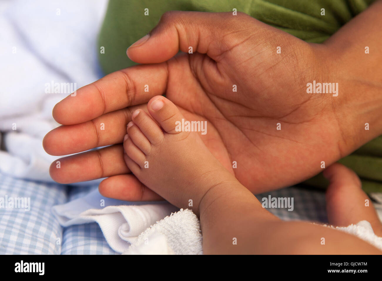 mother and baby, young family, protecting, warm colouring Stock Photo