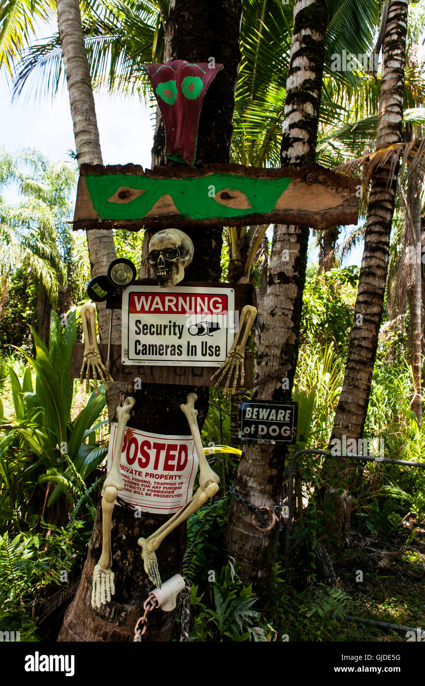 A scary warning sign, Big Island, Hawaii, USA. Halloween-like, but used  year round, to warn and discourage intruders and trespassers. Forewarned  Stock Photo - Alamy