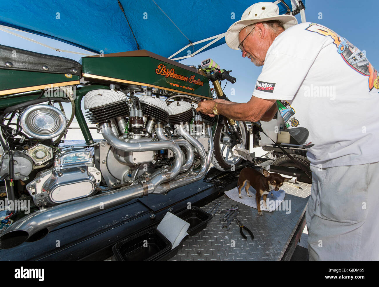 Wendover, Utah, USA. 14th Aug, 2016. A motorcycle is worked on in pit row during the 68th Annual Speed Week at the Bonneville Salt Flats, a dry lake bed some 110 miles west of Salt Lake City. Bonneville, with its wide, flat expanse of hard-packed salt, has been the site of numerous attempts at world land speed records. Credit:  Brian Cahn/ZUMA Wire/Alamy Live News Stock Photo