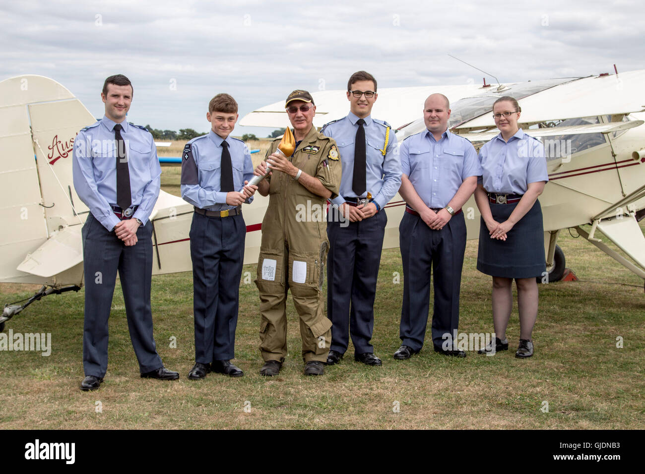 Essex-Uk - Royal Air Force Air Cadets celebrate 75th Anniversary with torch relay though Essex, UK. 14th Aug, 2016. Cadet and staff pass the torch over for a flight in a vintage aircraft Credit:  darren Attersley/Alamy Live News Stock Photo