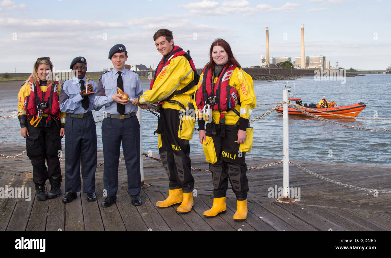 Essex-Uk - Royal Air Force Air Cadets celebrate 75th Anniversary with torch relay though Essex, UK. 14th Aug, 2016. The torch is handed over to the RNLI to take to kent wing across the themes. Credit:  darren Attersley/Alamy Live News Stock Photo