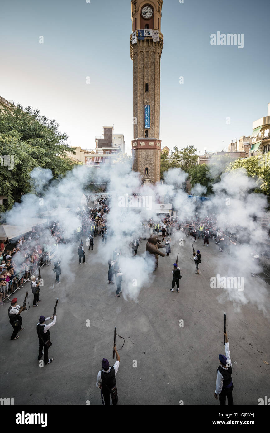 Barcelona, Spain. 15th August, 2016. 'Trabucaires' shoot their blunderbuss guns during 'The Festa Major de Gracia', one of the greatest and oldest summer festivals in Barcelona. Local residents work all year to change their respective streets in colorful and fantastic places, offering day- and nighttime activities during seven days of all kinds and shapes attracting nearly 2 million visitors Credit:  Matthias Oesterle/ZUMA Wire/Alamy Live News Stock Photo