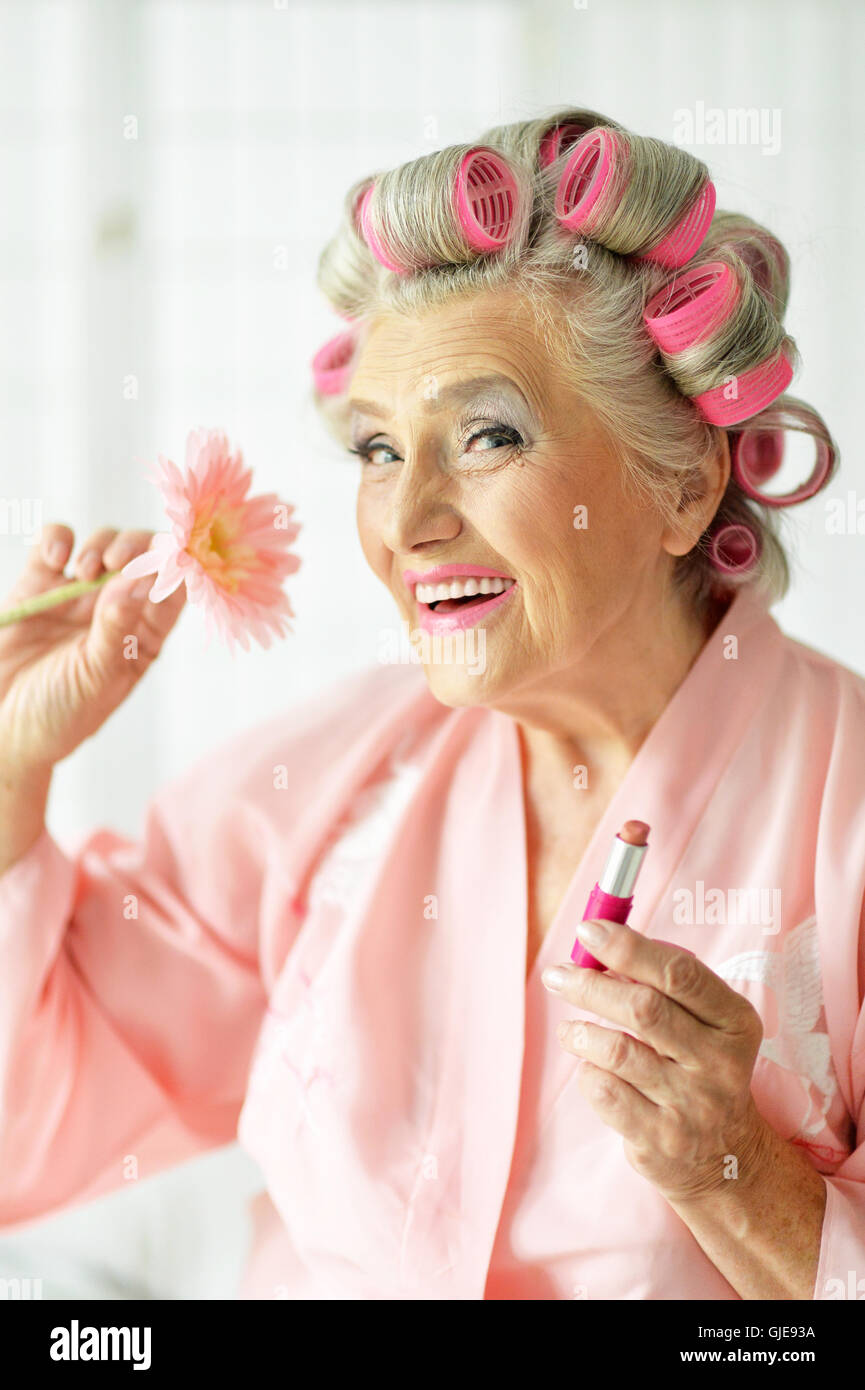 Senior woman in hair rollers Stock Photo - Alamy