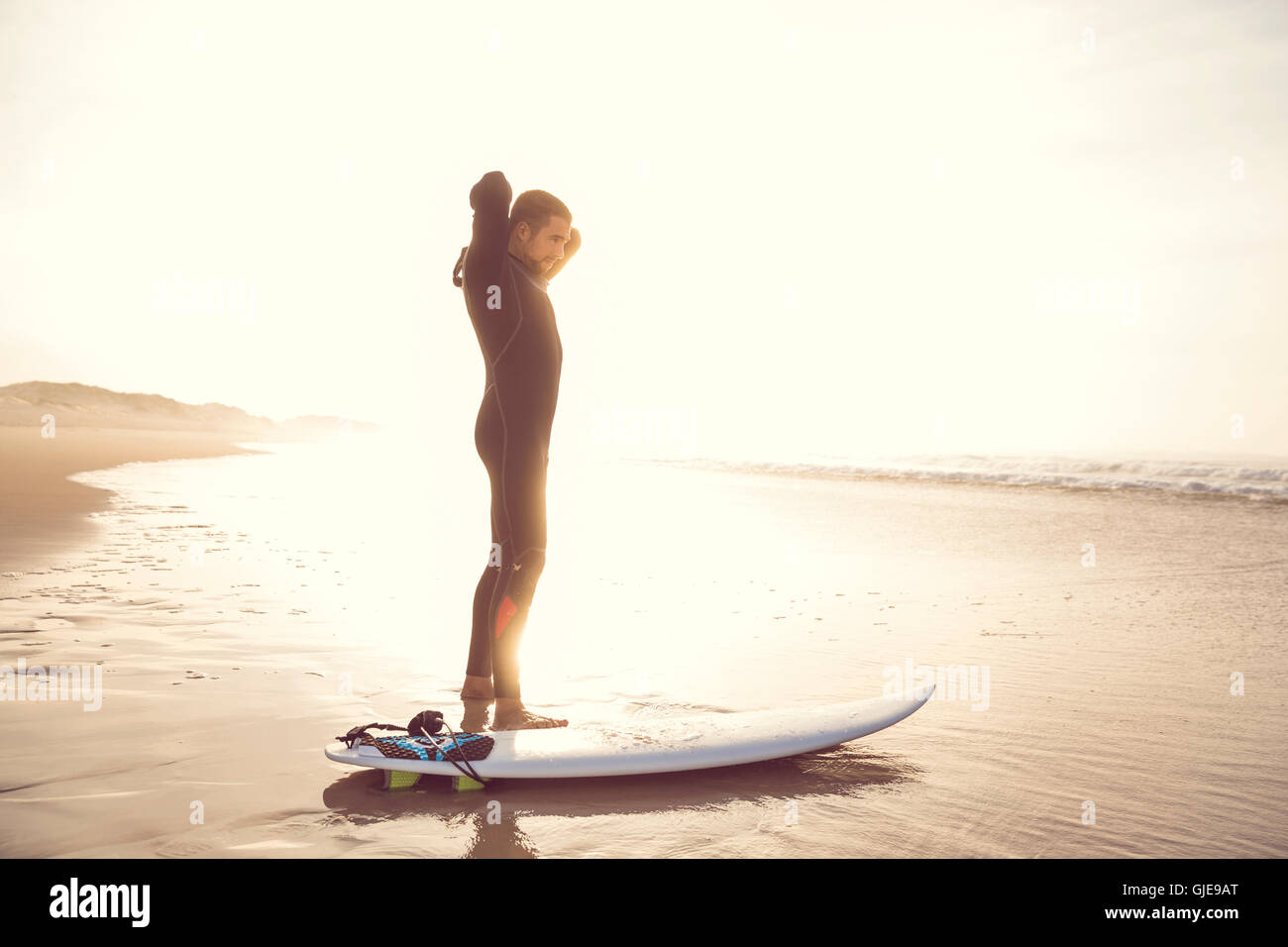 A surfer getting ready for the surf Stock Photo Alamy