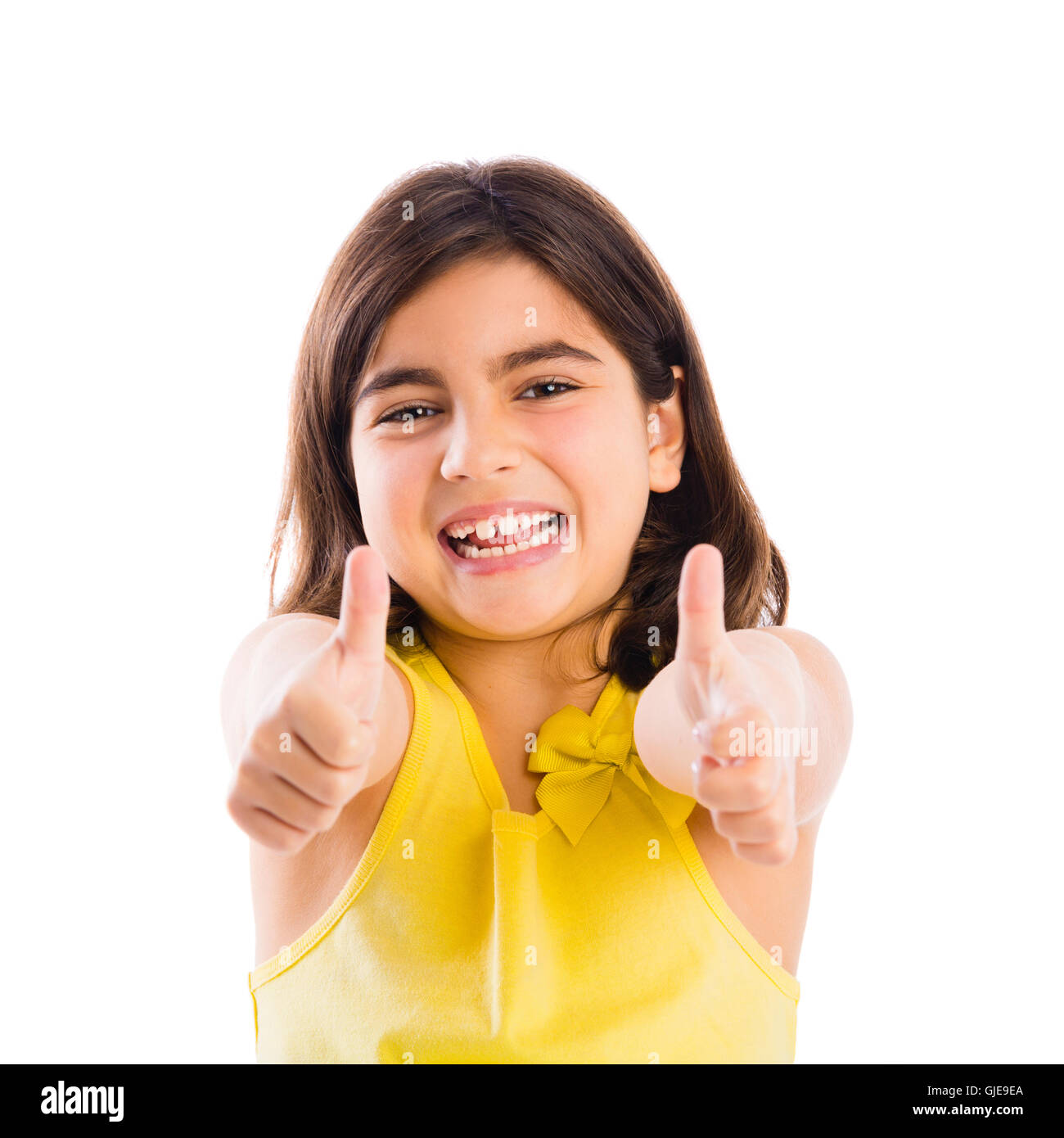 Studio portrait of a beautiful girl with thumbs up, isolated over white ...