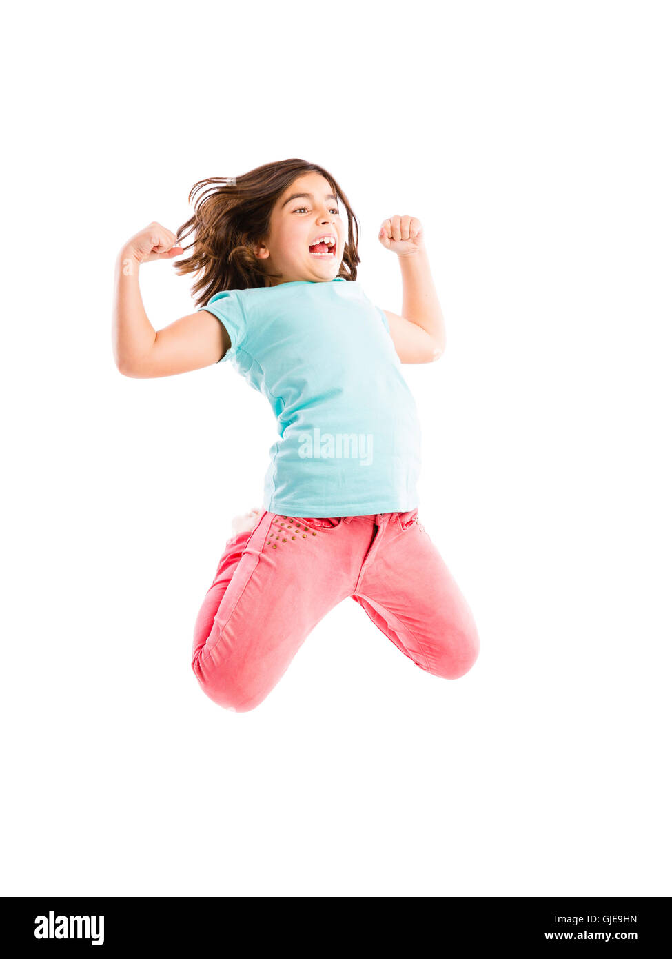 Beautiful and happy young girl jumping Stock Photo