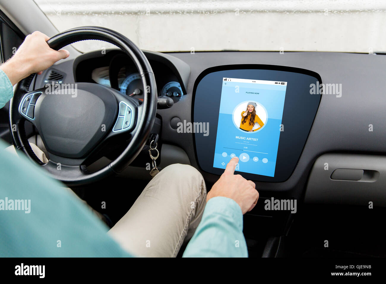 man driving car with music on board computer Stock Photo