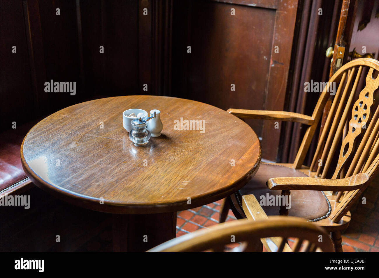 close up of vintage table and chairs in irish pub Stock Photo