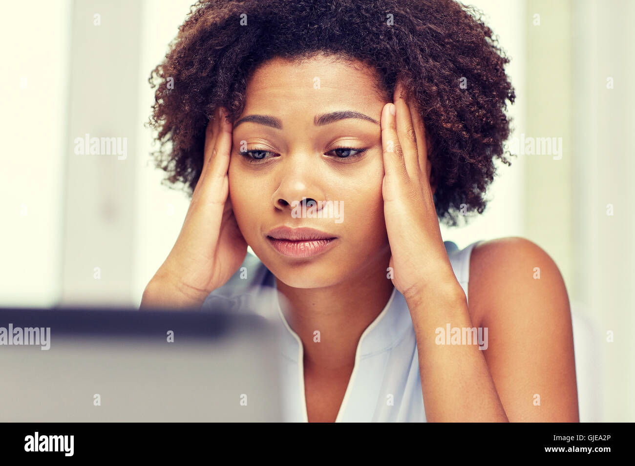 african woman with laptop at office Stock Photo - Alamy