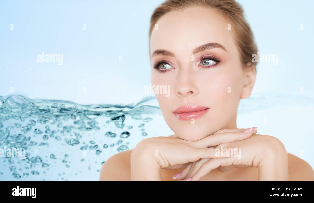 beautiful young woman face and hands Stock Photo - Alamy
