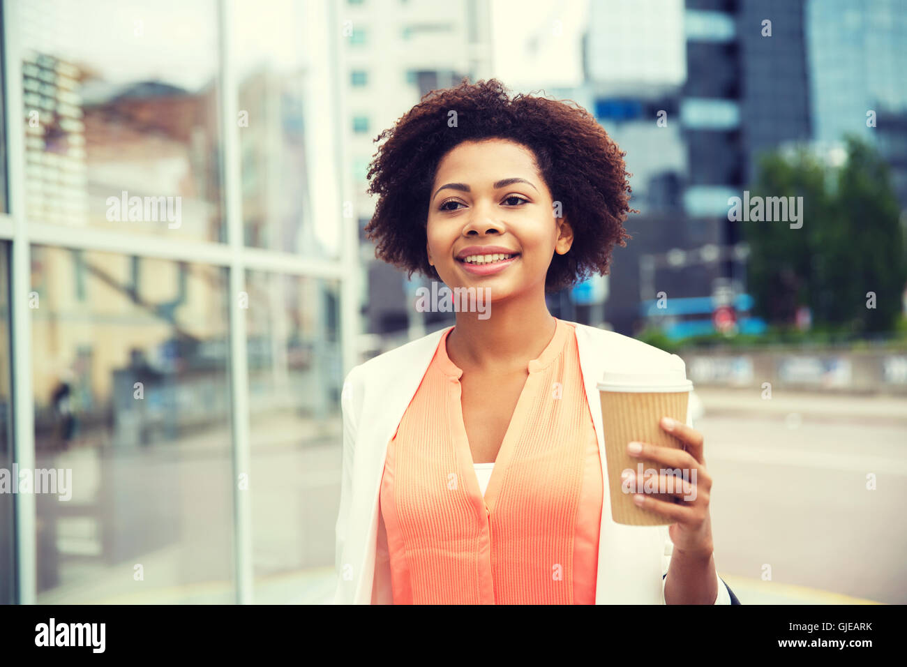 happy african businesswoman with coffee in city Stock Photo - Alamy