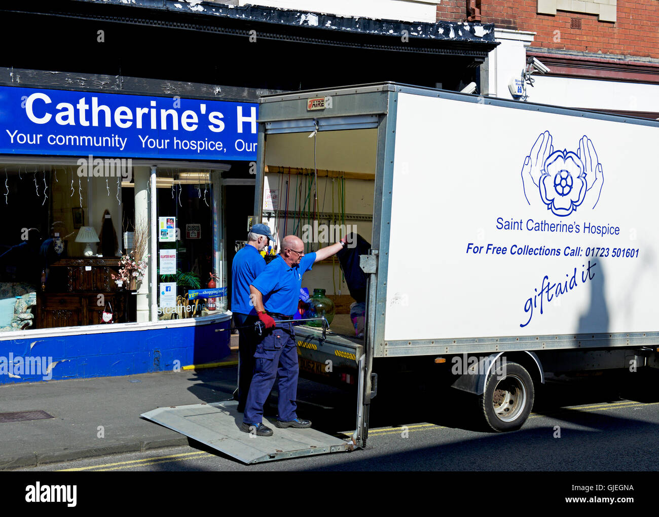 Delivery van outside charity shop, for Saint Catherine's Hospice, Scarborough, North Yorkshire, England UK Stock Photo