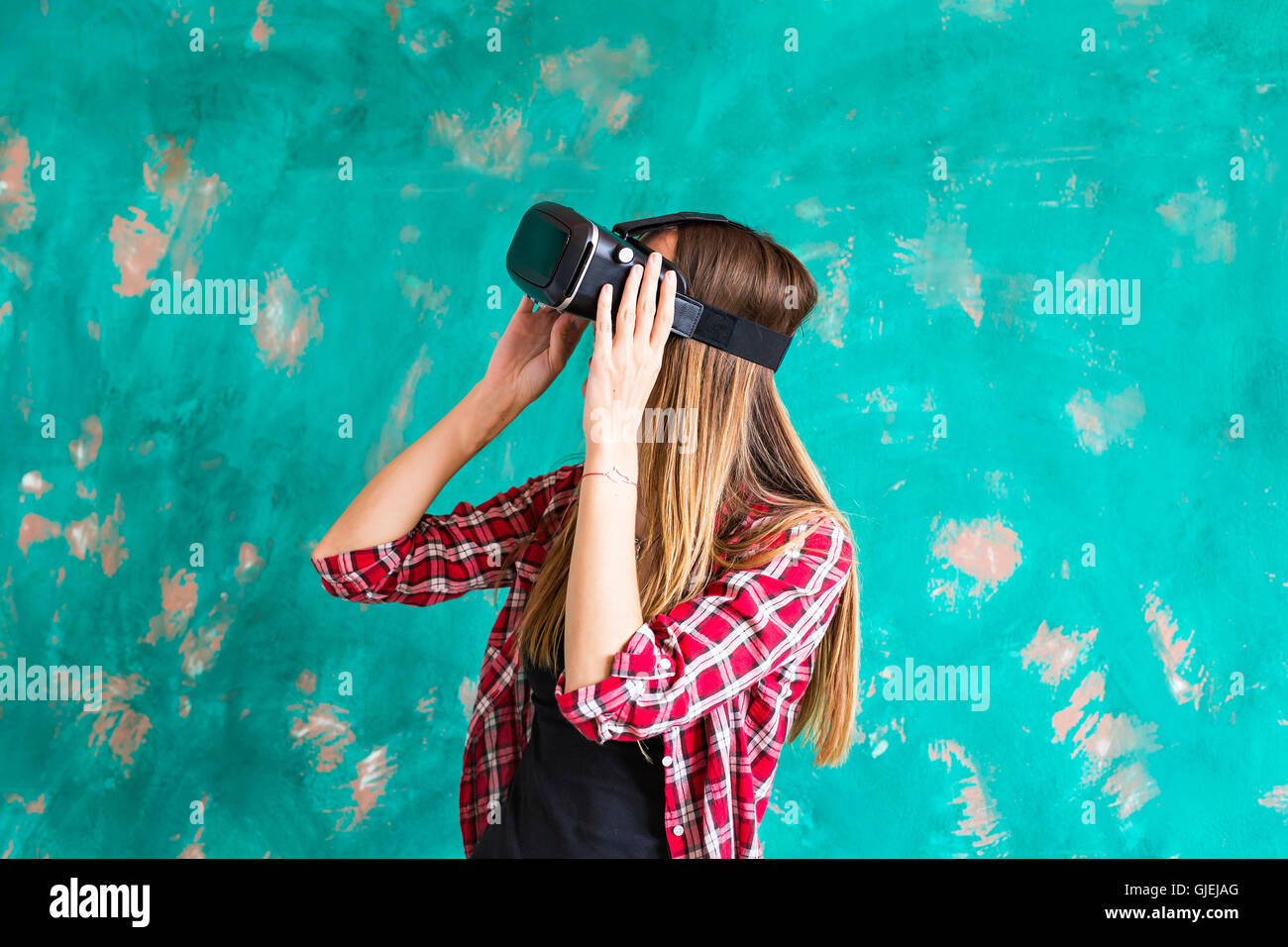 technology, virtual reality, entertainment and people concept - woman with vr headset playing game. Stock Photo