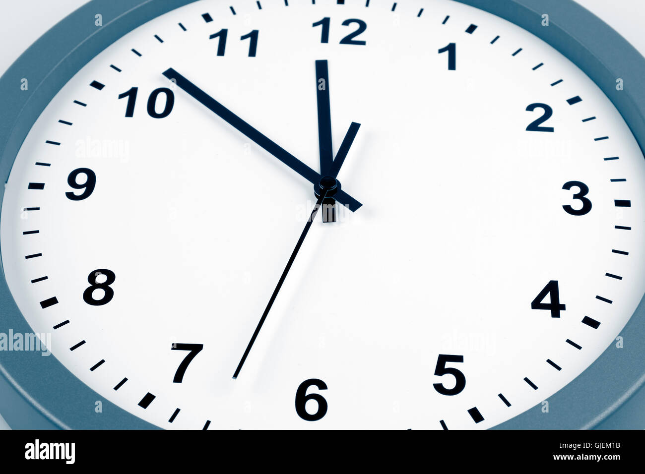 Closeup of hands on clock face Stock Photo Alamy