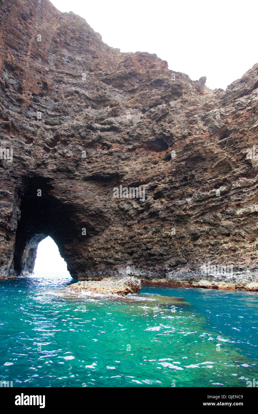 Sea cave and arch on the rugged Napali Coast of Kauai, Hawaii, USA. Stock Photo
