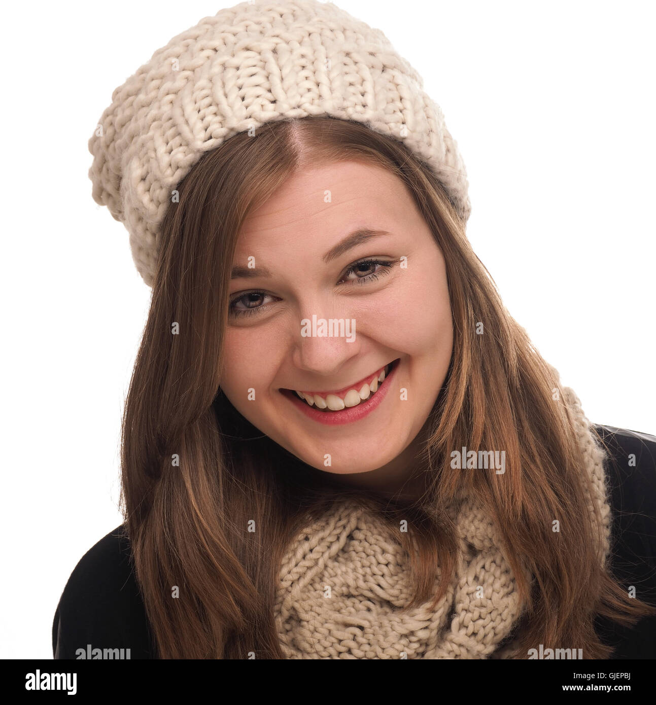 Attractive teenage girl dressed with wool cap and scarf on a white background Stock Photo Alamy