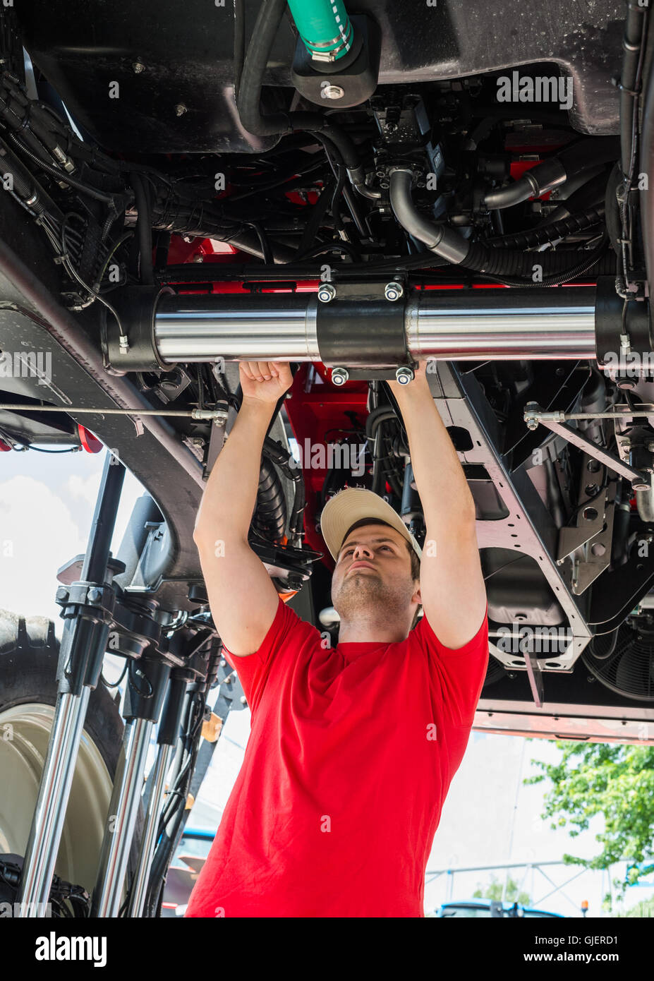 Auto mechanic working underneath a lifted Stock Photo Alamy