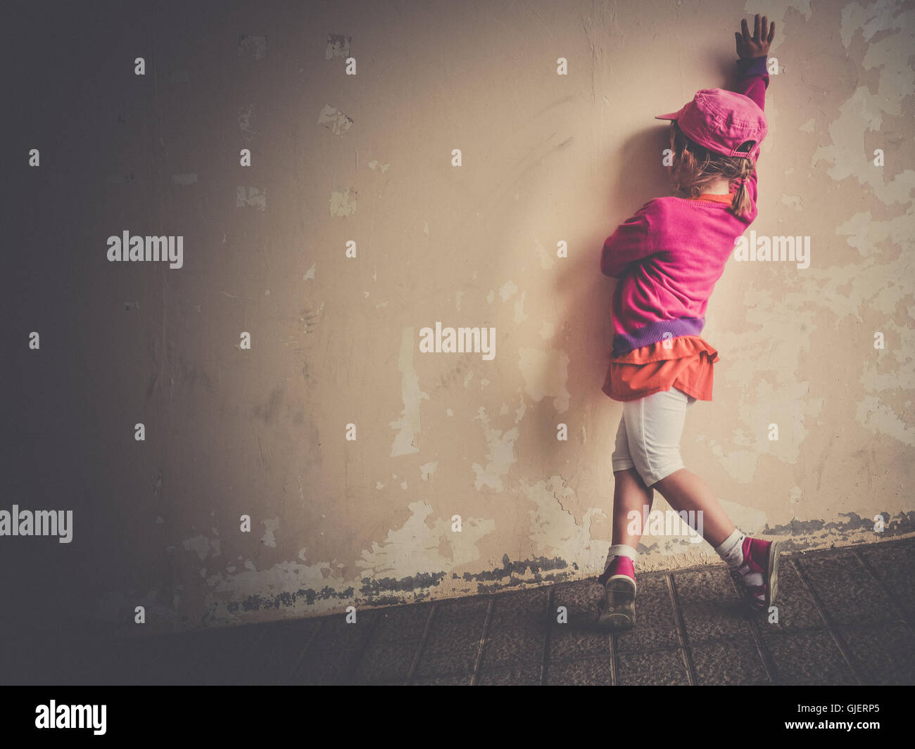Little four years old girl practicing her salsa dancing moves outside a