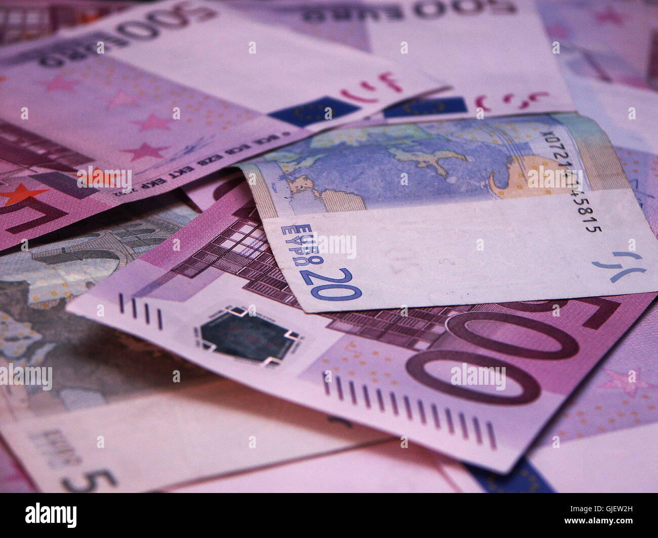 a pile of money Stock Photo - Alamy