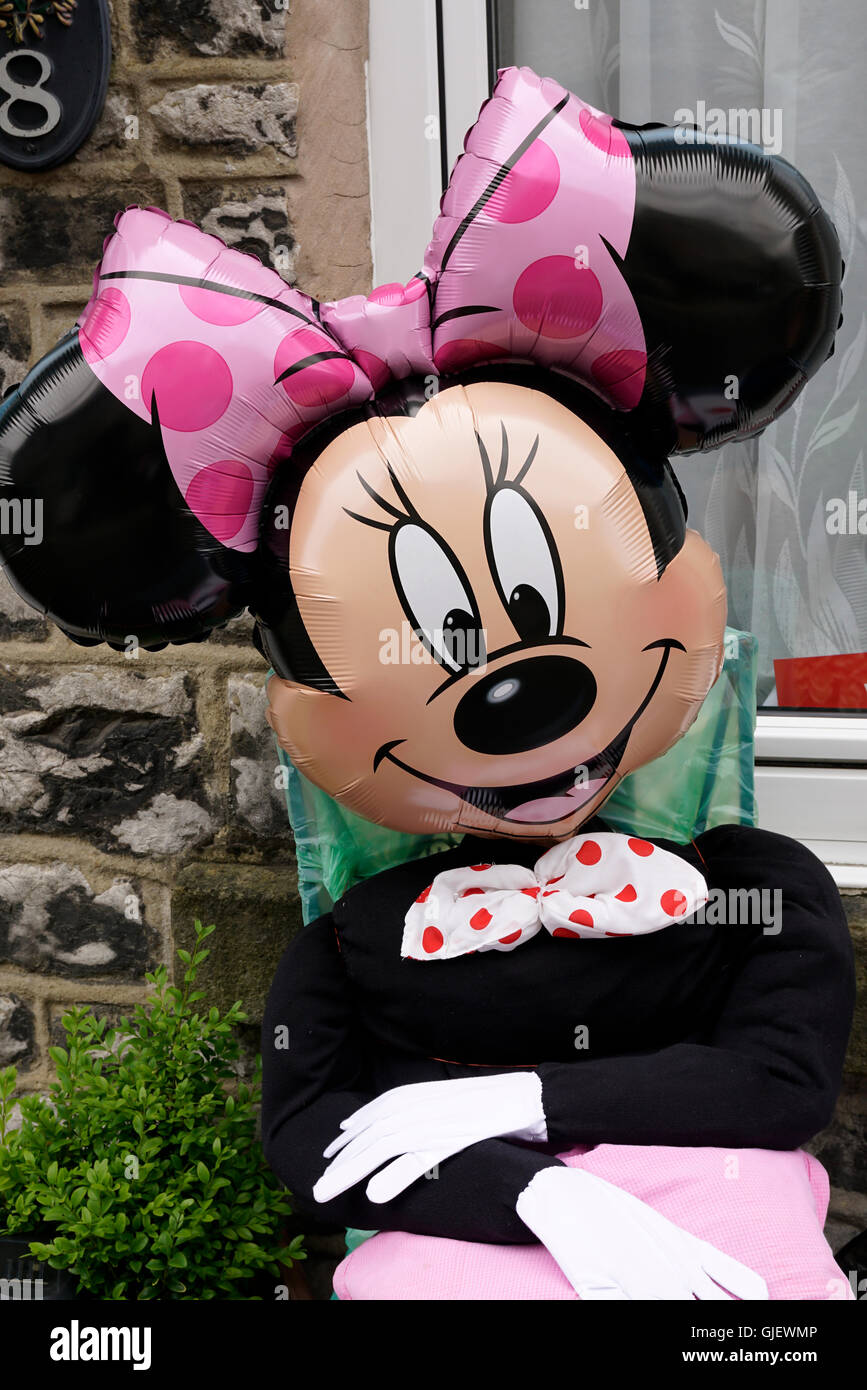 Minnie Mouse character Doll dressed in clothing in Tideswell Peak district Derbyshire Stock Photo