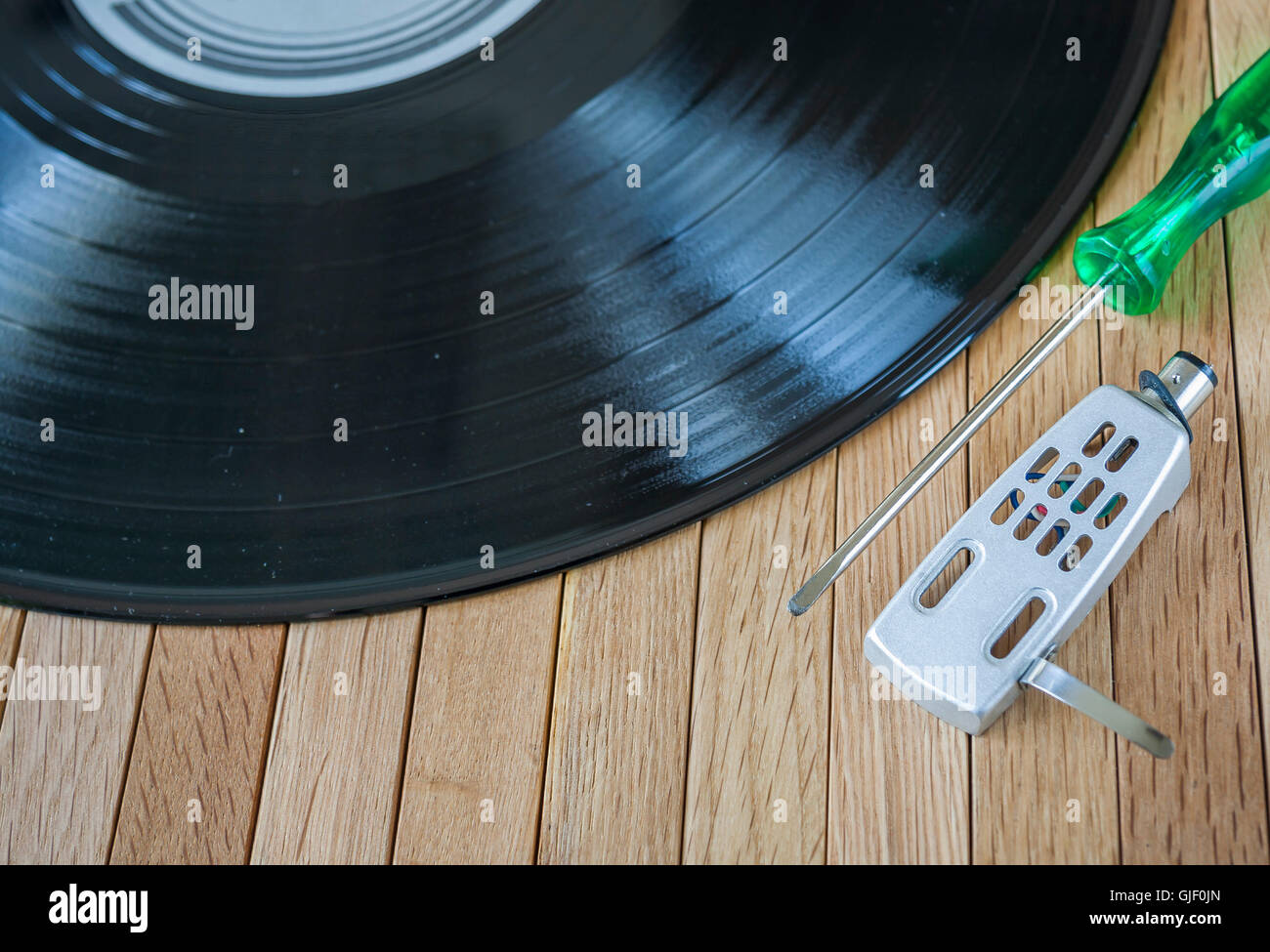 Vinyl Record with a Screwdriver and Head shell Stock Photo Alamy