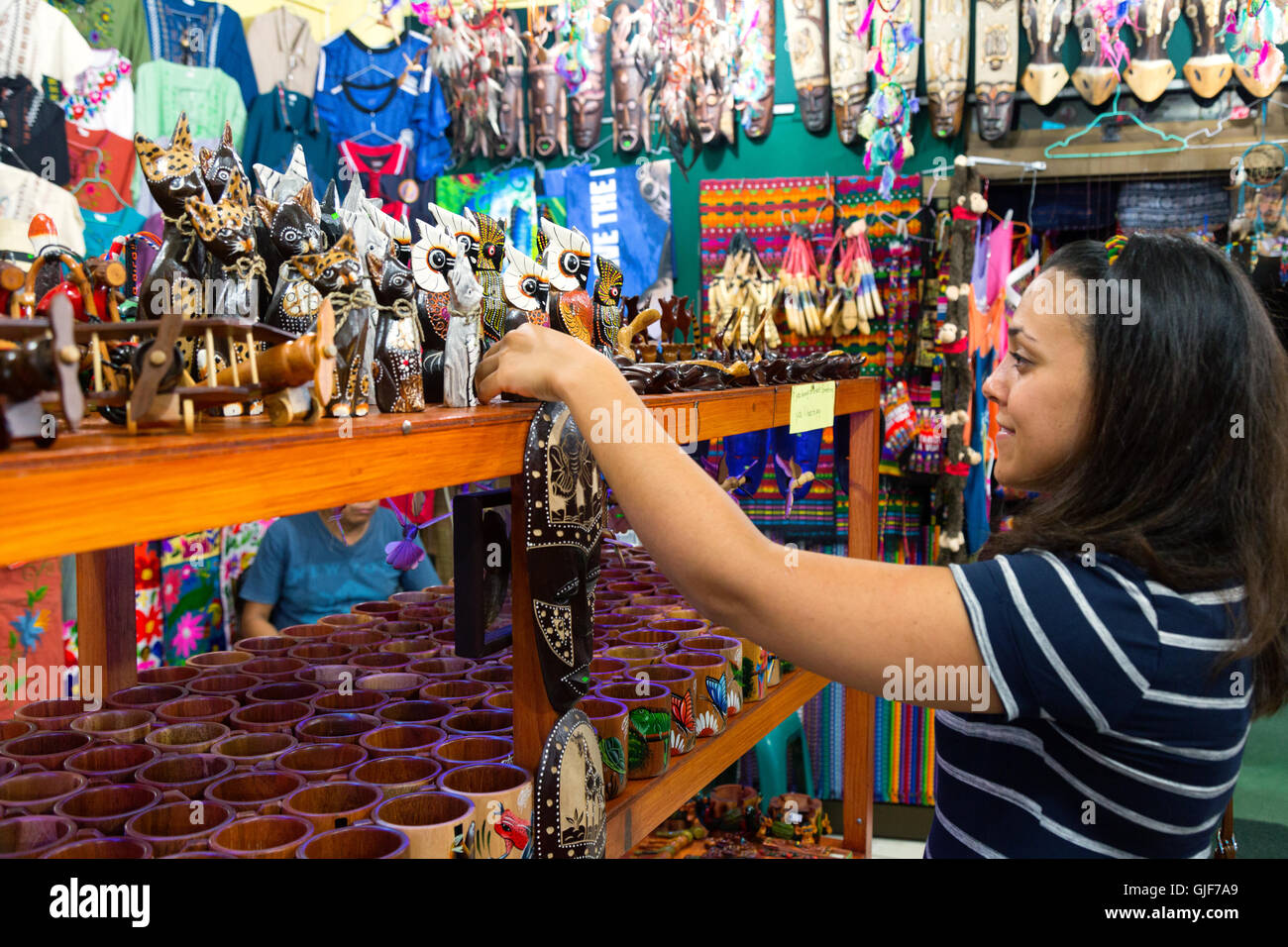 Yung woman buying gifts in a craft shop, La Fortuna, Costa Rica, Central America Stock Photo