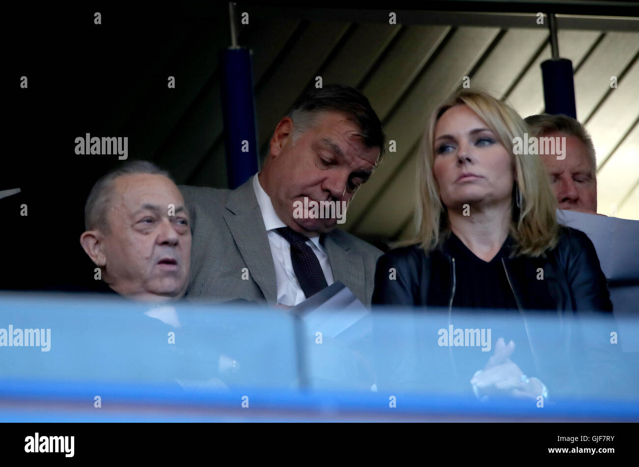 England manager Sam Allardyce (rear) in the stands behind West Ham United joint-chairman David Sullivan (left) and his partner Eve Vorley during the Premier League match at Stamford Bridge, London. Stock Photo