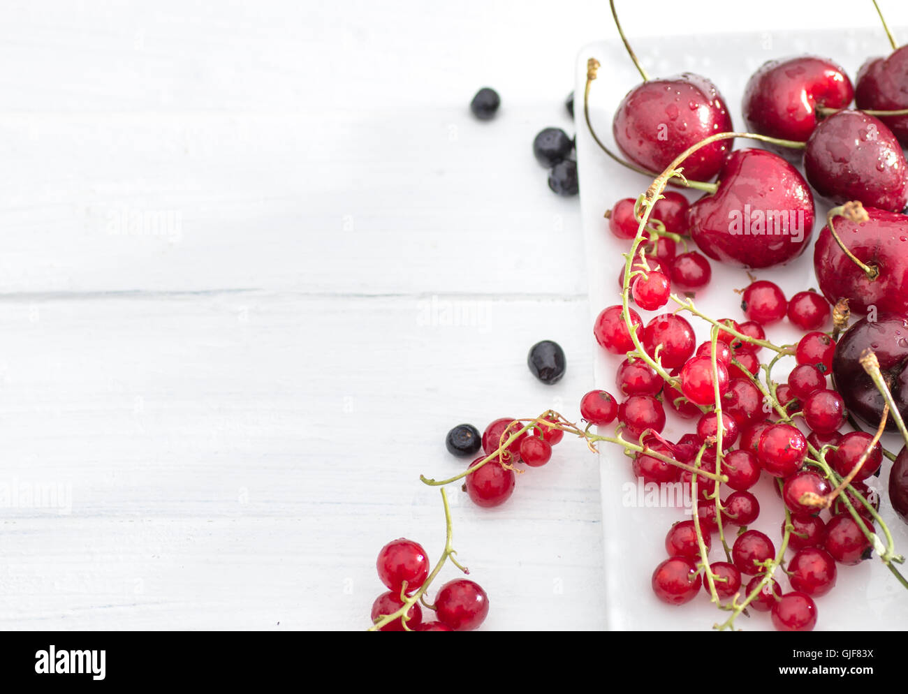 Red currant and cherry top view Stock Photo