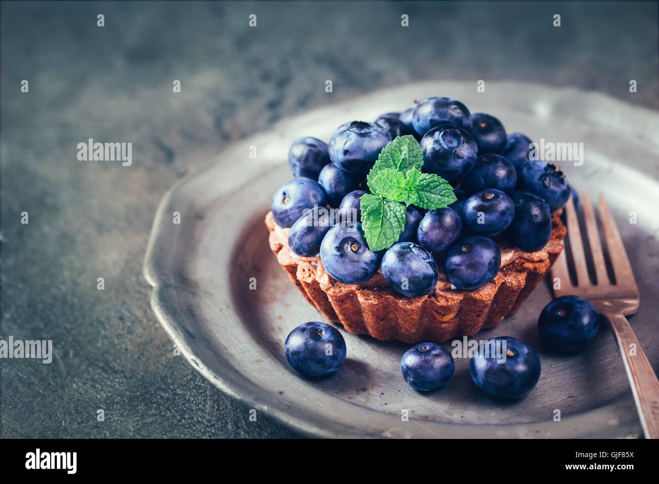 Blueberry mini tarts on plate Stock Photo