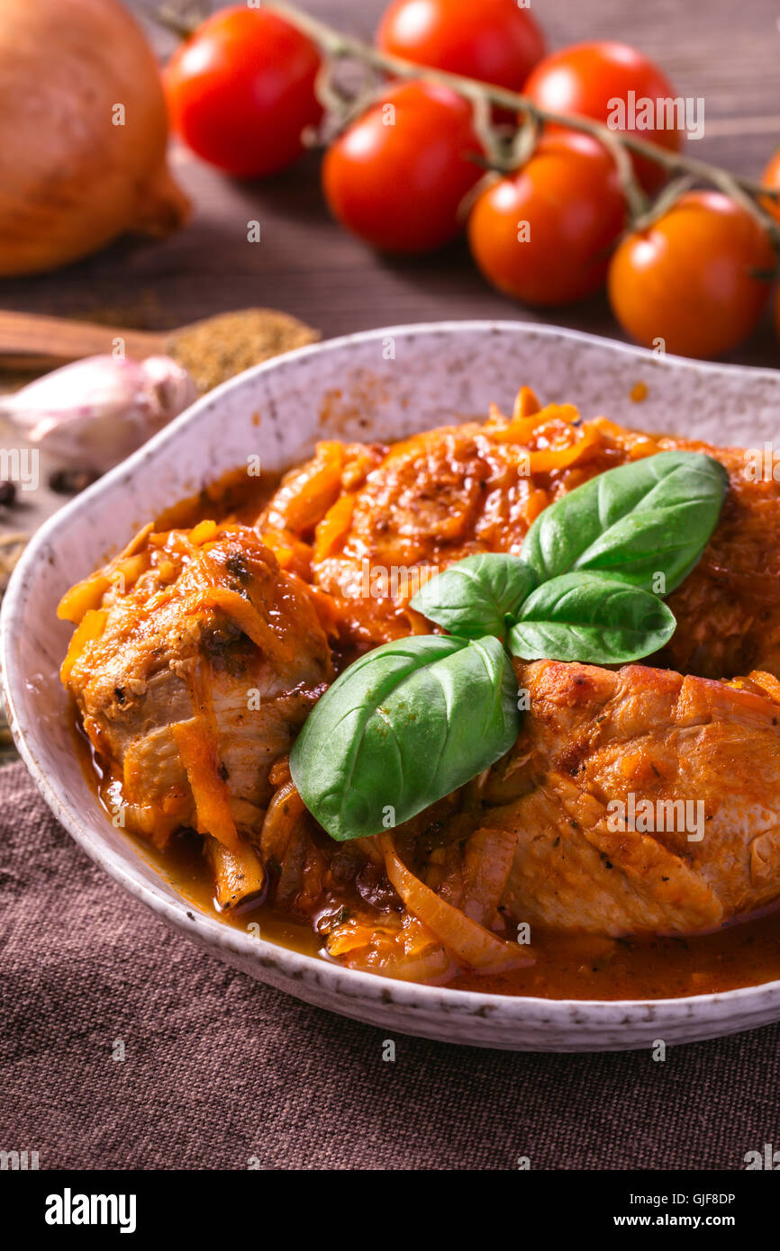 Chicken stewed with tomato Stock Photo