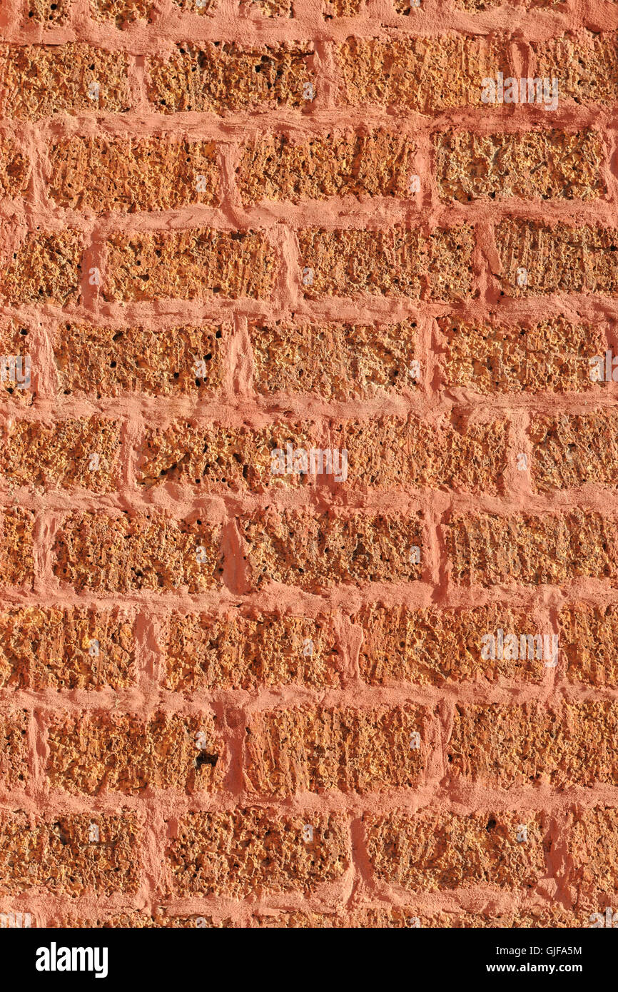abstract ancient orange laterite brick wall Stock Photo