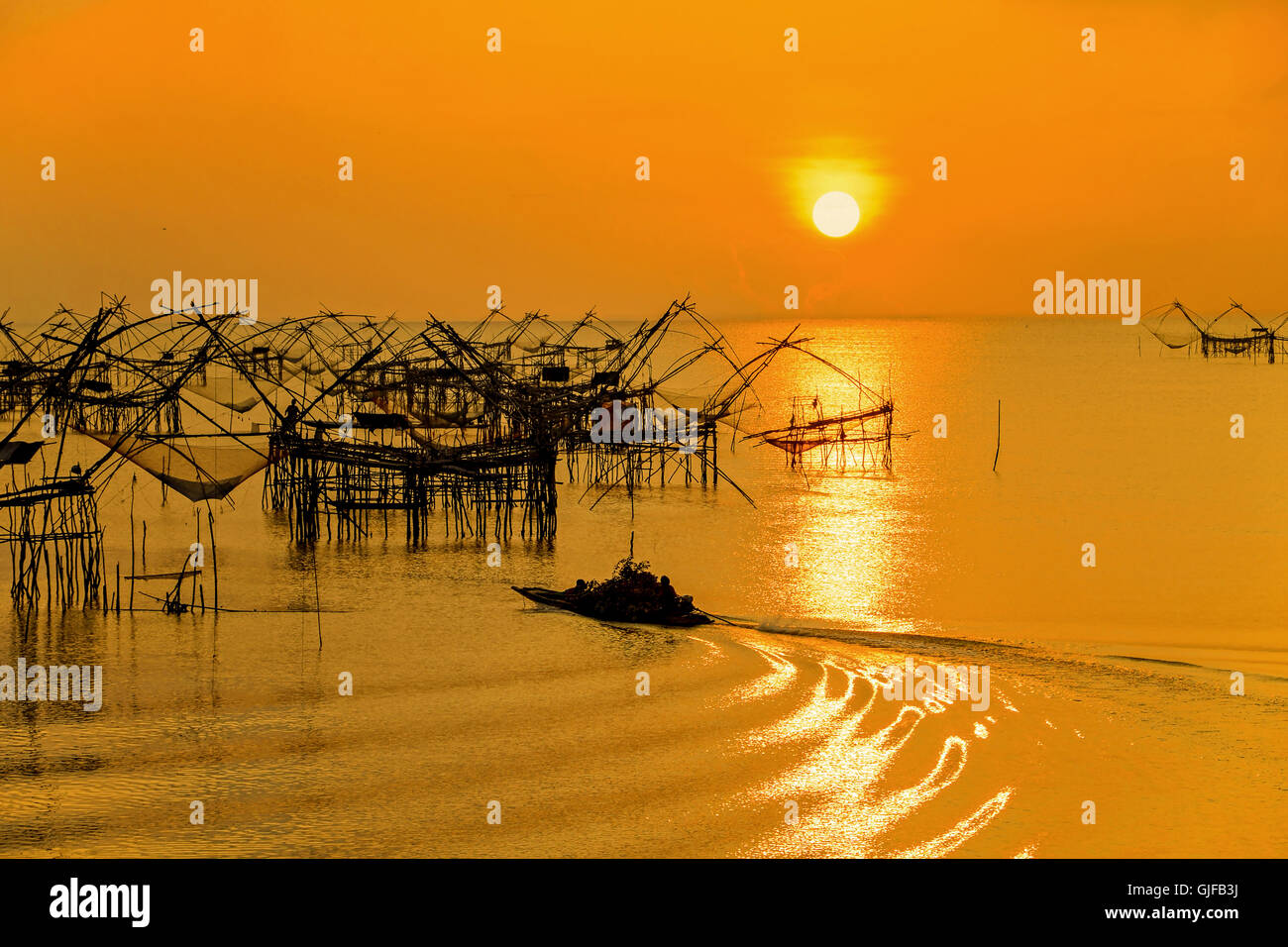 Morning sunrise withThai folk fishery style at Pakpra, Pattalung, Southern, Thailand. Stock Photo