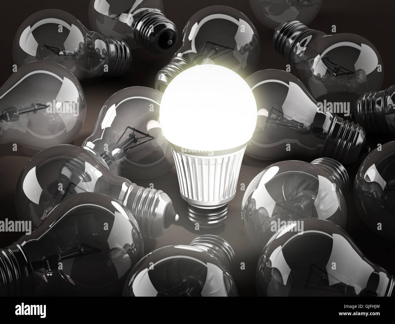 Energy efficient light bulb among standard light bulbs. 3d illustration. Stock Photo