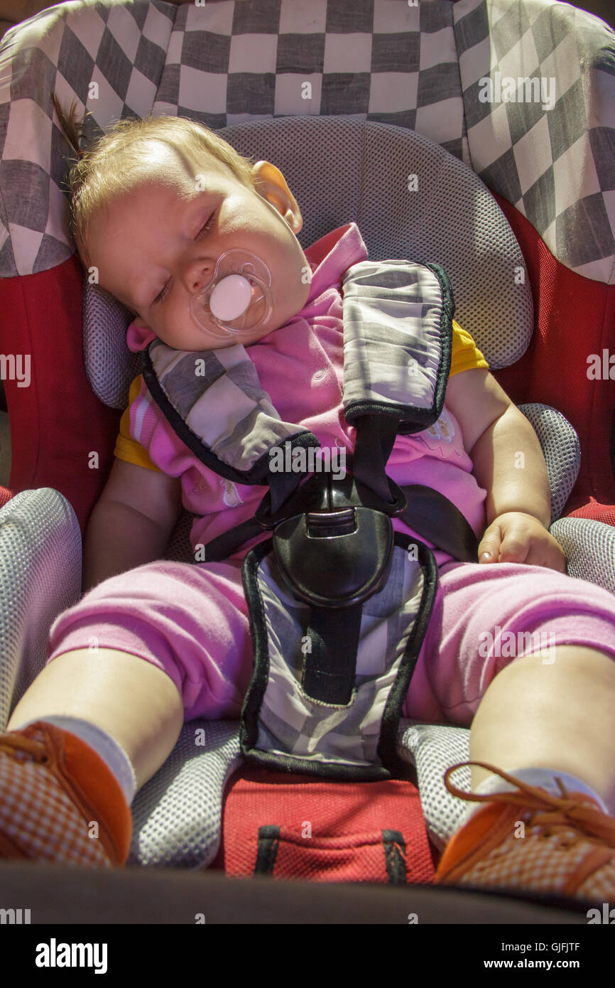 little newborn baby girl rests in the car seat Stock Photo Alamy