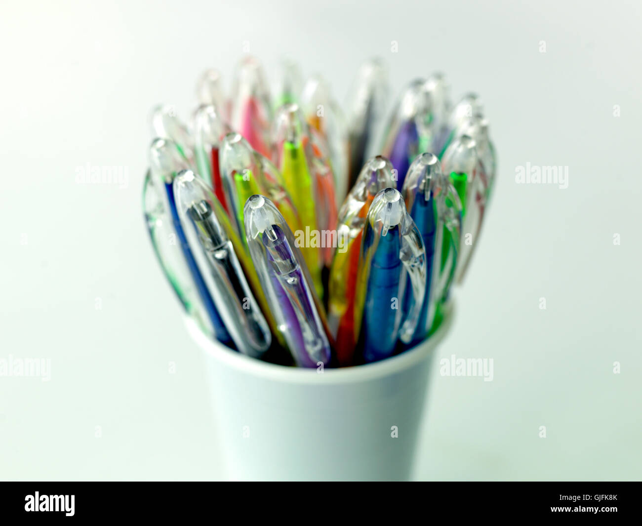 Color pens in white cup Stock Photo - Alamy