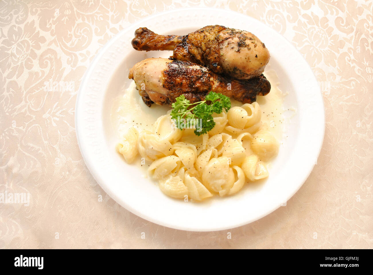 Baked Chicken Leg Dinner Served with Creamy White Cheddar Macaroni and
