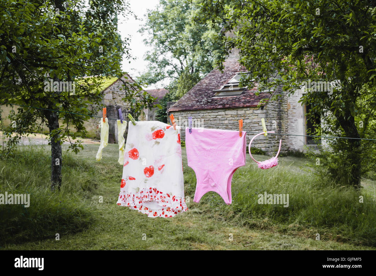 house of little princess. Little girl’s outfit on drying line outdoor Stock Photo